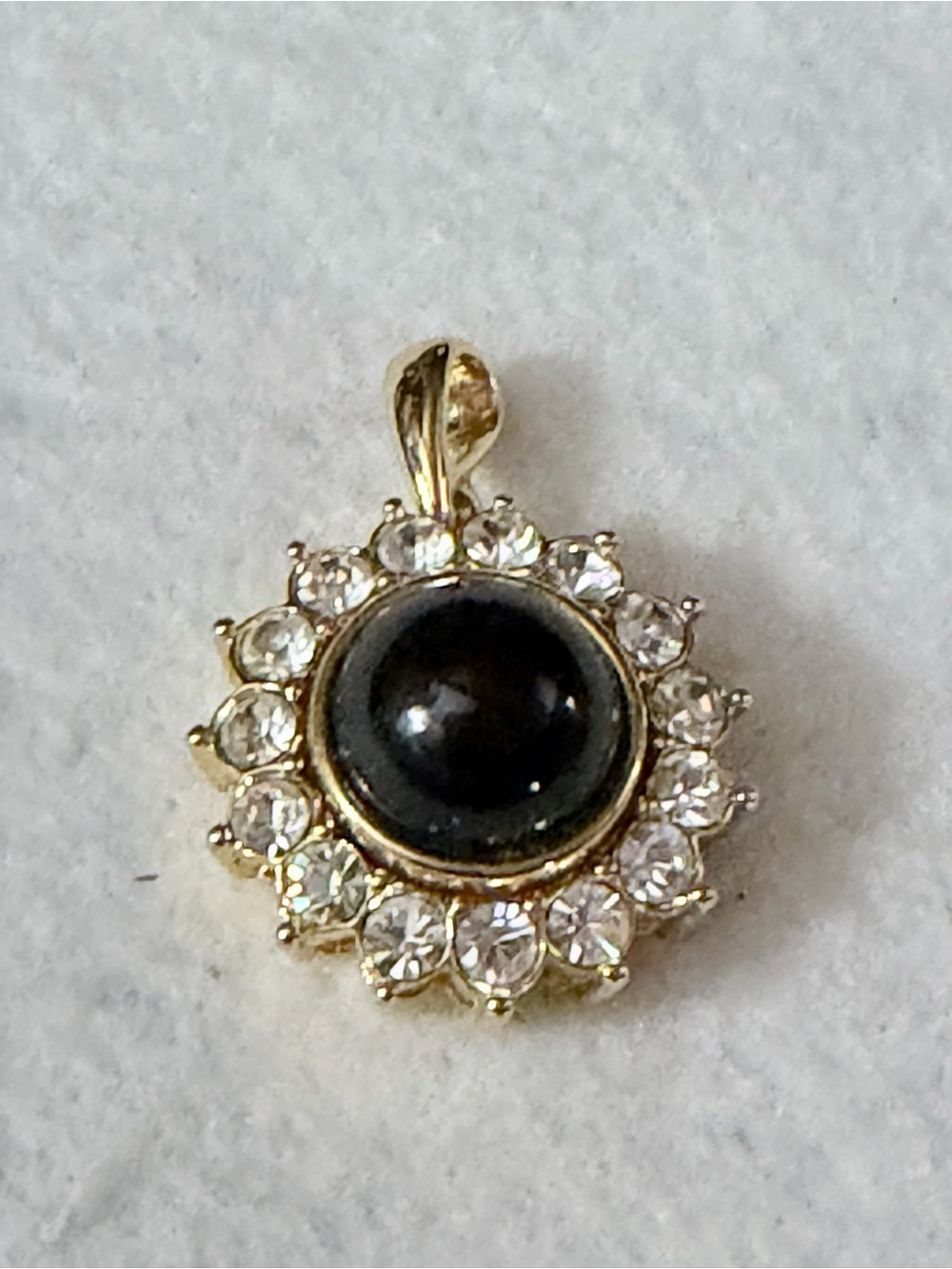 Nolan Miller Gold-Plated Black Stone Halo Pendant with Clear Crystal Accents